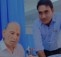 Patient doing guided balance and squat exercise with a physiotherapist at Dr. Harish Kumawat Physio Hospital Kuchaman